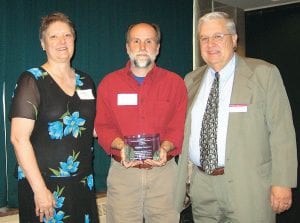 Timothy Cochrane, superintendent of Grand Portage National Monument received an award for his book, Minong - The Good Place from Adele Krusz of Friends of Duluth Public Library and Bill Sozansky, UMD Library Director at a May 16 Northeastern Minnesota Book Awards ceremony. Minong is a history of the North Shore Ojibwe and their relationship with Isle Royale.