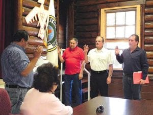 The newly elected members of the Grand Portage Reservation Tribal Council were sworn in by Chair Norman Deschampe at the council meeting on Wednesday, June 30. (L-R) John Morrin, Dean Deschampe, Rob Hull. Outgoing Councilwoman Lorraine Wipson looks on. The Tribal Council meets the last Wednesday of each month at 6:30 p.m. at the Old Community Building, Grand Portage.