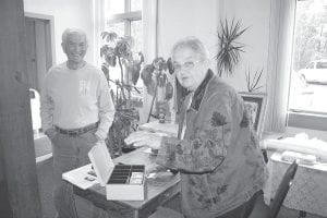 The Cook County Historical Society held its annual fishcake fundraiser at St. John’s Hall on Friday, June 25, 2010. John Henry and Sharon Eliasen continued their tradition of making the fishcake batter, cooked up by Nancy Kemp and friends from Hovland. Many others helped make the dinner possible. Barb Erickson and Wayne Anderson were two of the last workers plating food in the kitchen, and Eleanor Waha worked the donation table until the last participant arrived. Proceeds go to fund the school field trip “passport” program that takes elementary students to historic places all around the county and along the North Shore. Fundraising efforts will also help pay for a CCC display being put together. It will include a replica of CCC living quarters. Above: Myron Bursheim with Eleanor Waha at the donation table. Left: Gene Erickson with a a delicious plate of fishcakes with lots of other trimmings