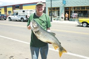 Steve Ford, co-owner of South of the Border Café in Grand Marais, took the morning off to go fishing on Thursday, July 8. He caught this massive 32-pound, 40-inch-plus lake trout on a “local lake—a really big one.” Steve said it took about 15 minutes to reel it in. “It put up a really good fight,” he grinned.