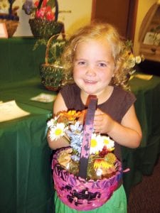 Although all of the flowers entered in the Grand Marais Garden Club’s show were beautiful, no display was more heartfelt or precious than that of 3-year-old Grace Blomberg.