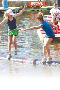 Jessica Berg-Collman (left) rolling to victory at the Namekagon River Roll-Off.