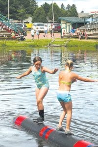 Above: Wellesley Howard- Larsen (left) competed against teammate Taryn Hanson at the Namekagon River Roll-Off. It was the first time these youngsters competed in a logrolling tournament and both girls had a great time in Hayward, Wis.