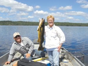 Gail and Terry Englund of Grand Marais had a great day of fishing with Mike Berg of Seagull Creek Fishing Camp. Gail caught and released this 31-inch walleye, earning a 