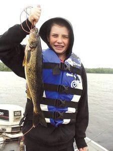 Sean Lohmann of Minnetonka, MN with the 19.5 inch walleye he caught while fishing with Joe Carlson of Joe’s Inland Fishing Guide service earlier this month. Joe said it was a nice day of catching lots of “smalleyes.” Sean used a jig or beaver flick with leeches.