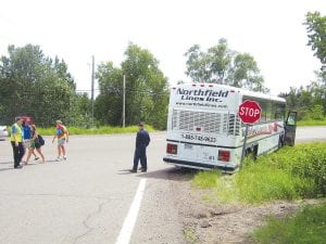 A Northfield Lines charter bus full of teenagers heading back home to the Twin Cities after being at Cathedral of the Pines Camp had a mishap at the corner of the Caribou Trail and Highway 61 just before 2:00 p.m. Monday, August 2, 2010. The person who notified the Cook County Law Enforcement Center said that the bus had lost its brakes. According to some of the kids on the bus, the bus veered into the stop sign, breaking the front side window. Traffic was very heavy in both directions on Highway 61, and the bus avoided both the highway and the very steep ditch. According to Deputy Sheriff Don Phillips, hydraulic brakes can lose their pressure if they get too hot. As kids were being transferred back to Cathedral of the Pines to wait for a replacement bus, one of the kids called out, “Yay! Now we get to spend another hour at camp!”