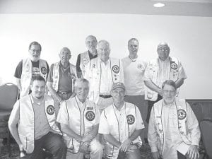 The 2010/2011 Grand Marais Lions Club officers are (L-R, front) Andrew Smith, Dick Parker, Bob Spry, Al Taenzer. (L-R, back) Glen Siegle, Walt Mianowski, Ken Wielenski, Doug Anderson, Max Bichel, Mark Sandbo.