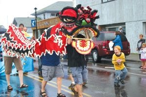 Part of the Dragon Boat Festival fun is the “Parade of Teams,” with dragons, dancing, squirt guns and water balloons, which are greatly enjoyed by the kids in the crowd.