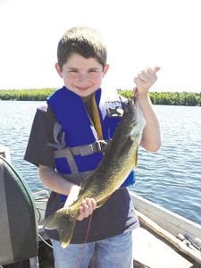 Matthew Blaschko, 8, of Chaska, MN, was out with his mother Diane and sister Megan when he caught this 19-inch walleye at the end of the trip. Joe Carlson of Joe’s Inland Fishing Guide Service said Mathew called out, ‘’Supper!”’ as the fish was landed. The family also caught some nice t r smallmouth bass