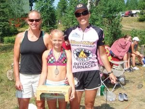 North Shore Rollers champion boom runner Tarin Hanson with her coaches Julie Collman (left) and Jenny Atkinson.