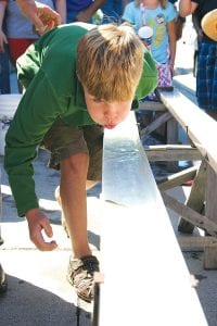 It wouldn’t be Fisherman’s Picnic without some fishy games! Top: If you blow on your minnow, it goes faster! Right: The tension was high as the minnows made their way down the racetrack on Saturday, August 7.