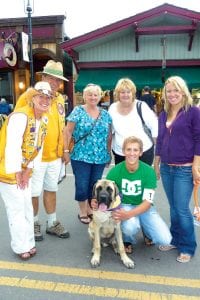 Lions Cathy Everett and Karl Hansen congratulate Cutest Puppy Contest winner “Clark” the English Mastiff and his owner Ryan Kosek and Ryan’s family.