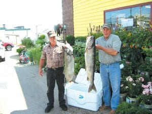 The fishing Spry family fared well in the Buck’s Hardware Fisherman’s Picnic Big Fish Contest, taking first and second place in the lake trout category. Larry Spry (right) won the category with his 25 pound 1 ounce trout and Jerry Spry took second with a 22 pound 14 ounce trout.