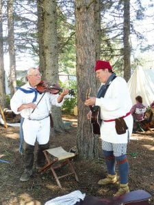 Entertaining the voyageurs in the encampment under the pines was Boon’s Lick Strings—Al Bucknat of St. Louis, Missouri and Joe Tesson of Warrenton, Missouri.