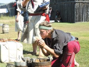 Joe Manduca of Old Fort William, Thunder Bay, was able to start a fire using flint and tinder in the Rugged Voyageur Contest on Saturday.