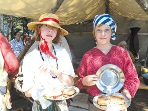 One of the most enjoyable events of Rendezvous Days (for the judges, at least) is the Golden Galette, which challenges encampment residents to create a culinary delicacy with the ingredients that were on hand in the voyageur’s day. Judges were last year’s Galette winner Paul Prenevost of Excelsior, MN; Shannon Nelson of Hayward, WI; and News-Herald editor Rhonda Silence. Megan Cline won first place for her non-traditional but delicious strawberry galette sprinkled with sugar. Winning the coveted Golden Galette was MaKenzie Patterson of Thunder Bay with an enticing blueberry-stuffed bannock.