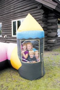 Kids enjoyed the two giant inflatable playgrounds at the Cook County Fair—this maze and another bounce house.