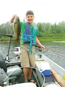 On August 11, William Bauer caught this hefty 18½-inch bass while fishing with guide Joe Carlson. William's sister was delighted with the catch and recommends a visit to Joe's website: www.boreal.org/gofish/.