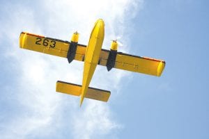 A Minnesota Department of Natural Resources Bombardier CL-215 water bomber flew between Gunflint Lake and the Lizard Lake wildfire on Sunday, August 29 as high winds kicked up the fire.