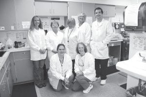 The laboratory technicians at Cook County North Shore Hospital who have once again earned accreditation from the College of American Pathologists are (L-R, kneeling) Bryann Bockovich, Nadine Brown. (L-R, standing) Jennifer Backstrom, RoseAnn TerSteeg, Gine Meissner, Denise Murray, Matt Lin. (Not pictured – Kathy Siesennop).