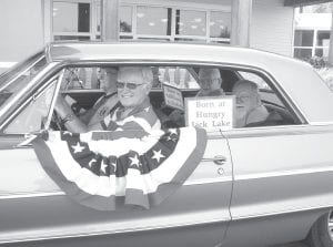 Bob Pratt with three men from the Care Center in his classic 1964 Chevy Impala car at Fisherman’s Picnic Parade. Jack Halverson, Earl Anderson, and the late Gerry Eisler. The theme was “Made in the U.S.A..