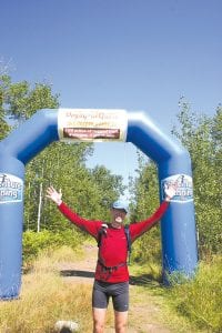 Runners in the Voyageur Quest Race enjoyed a second-day finish on the Pincushion Mountain Trails in Grand Marais. Mark Taminga of Dundas, Ontario led the Voyageur Stage Race by three minutes after the second leg. The trail runners covered 29 miles the first day and 28 miles the second day. Here Taminga celebrates as he finishes at the trail head of the Pincushion Mountain trails located at the scenic overlook about one mile above Grand Marais.