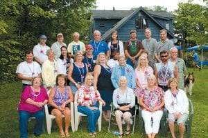 The Cook County Class of 1970 gathered at John Jacobsen’s home in Grand Marais on Saturday, August 7 and then lit up the parade in tie-dye T-shirts and flowered leis. Class spokesperson Kevin Twiest said, “The amount of fun we had must be illegal—but everyone was wellbehaved!” (L-R, front) Jean Bargabus DuRoche, Julie Somnis Aldinger, Jeanne Nelson Koetz, Marcia Allard Schultz, Christal Stone Kelehan, Janet Beirbaum Jadwin. (L-R, second row) Victor Pederson, Kristi Sjoberg Carambula, Loni Garner Gineris, Tamera Berglund Krause, Carol Olsen Thompson, Linda Olsen Durham, Scott Backstrom. (L-R, third row) Linda Shold Bellows, Dale Bockovich, Dave Oswald, Roseanne Bjerkness Hess, Todd Smith. (L-R, back row) John Anderson, Jeff Hoffman, Doug Finn, John Jacobsen, Karen Scheffler Eliasen, Kevin Twiest, Dan Bradley, Steve Leonard.