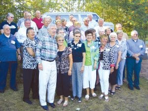 The Cook County High School Class of 1960 celebrated its 50th class reunion at Fisherman's Picnic. Fifty-six people attended a buffet supper and dance at The Landing on Devil Track Lake, followed by a picnic the next day at the Devil Track Campground. Class spokesperson Sue Hildebrand said, “For those who have not been back to Grand Marais for years, this weekend proved to be a wonderful reuniting of old classmates and renewing of friendships from high school days. Gorgeous North Shore weather provided the best backdrop for Fisherman’s Picnic Parade and the Class of ’60 –'Cook County’s Finest'– proudly rode a huge float, cheering all the way!” Pictured at the Class of 1960’s August 7 gathering at The Landing are (L-R, front) Jerry Linnell, Bobbi Zimmerman, Janice Seglem, Rollie Scott, Susan Toftey, Carol Nelson, Christy Harrison, Marvin Rude. (L-R, second row) Monna Anderson, Janice Toftey, Karen Haavisto, Polly Lehto, Bobbi Johnson, Skip Moyer, Bruce Leng. (L-R, third row) George Springer, Richard MacKenzie, John Tofte, Carole Noyes, Marilyn Stevens. (L-R, fourth row) Larry Thomsen, Bonnie Wonser, Sharon Moe, Glenn Jacobson, Larry Ryden, Butch Schulte. (L-R, back) Bob Jones, Bruce Wishcop, Rick Thompson, Richard Spry, Don Schliep, Abe Lund.