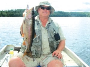 Vince Ekroot of Little Vince’s Guide Service shows off a recent catch—a 5-pound, 21-inch rainbow trout. Vince said it was caught on a night crawler at three feet off the bottom in deep water. That is all he will share—he said, “That’s a lot of info from a fishing guide.”