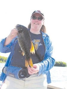 Jamye Wohlwend from Kansas City, Missouri caught this impressive 17-inch smallmouth bass in eight feet of water while jigging for walleye with Joe Carlson of Joe’s Inland Fishing Service.