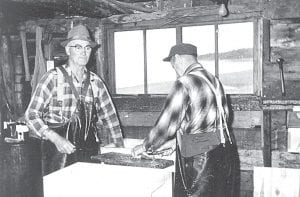 Jack Scott and John T. Skadberg at Jack’s Fishhouse by Kimball t e in e in Creek near what is sometimes called Cluck’s Point. MaryAnn Skadberg n ws ct n of ur of Grand Marais shared this picture which was taken by her n pap the brother, Myron Heimer, in 1961. John T. Skadberg was 67 years old la sif ed ection at the time and still hard at work cleaning herring with Jack Scott you newspap r) At who was the same age or older.