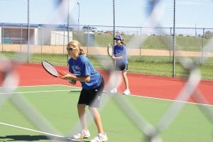 Left: In the Vikings’ first match against Duluth East, eighth graders Libby Zafft (in front) and Brenna Hay played #1 doubles. They won their match (6-1,6-4), becoming the first Cook County varsity tennis players to win a match. Above: Players on the 2010 Cook County girls’ varsity tennis team were all smiles after their first two tennis matches of the season September 1 at Duluth Central High School. This is the first year Cook County High School has had tennis teams. The girls’ tennis season is during the fall and the boys’ tennis season during the spring. (L-R, back) Molly Zafft, Shelby Ahrendt and Cecilia Schnobrich (L-R, front) Brenna Hay and Libby Zafft.