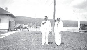 Delores Saethre of Grand Marais shared this photo of the US Coast Guard Station in Grand Marais. The picture is credited to Edward C. Willard and was taken on July 27, 1936. The men are Captain Holdren (on right) and Morse Rhea.