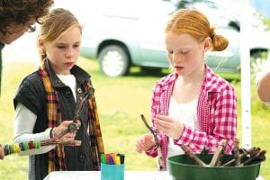 These young ladies enjoyed the creative opportunity to make their own musical instruments at the kids’ activity tent.