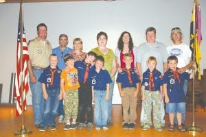 These young Scouts, pictured here with their parents, have completed one year as Tiger Cubs and will begin the new school year as Wolf Cubs. (L-R) The Scouts with their parents behind them are Noah Furcht, Dave Furcht, Adrian Howard-Larsen, Brian Larsen, Vaughn Swindlehurst, Karen Swindlehurst, Tristan Walton, Lisa Walton, John VanderHeiden, Lisa VanderHeiden, Lucas Sheils, Nathan Sheils, Silas Sobanja, Kurt Sobanja.