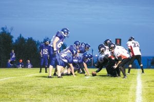 Action was fast and furious last Friday night when the Vikings faced the Mesabi East Giants. Both offensive lines opened giant holes for their teams' running backs, who, when combining their yardage, ran for more than one-half mile in the game.