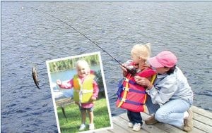 Little Cadence Welter had a great time fishing with Daryl and Laura Popkes of Birch Lake during Labor Day weekend. Above: Laura helps Cadence reel one in. Inset: Cadence shows off her catch.