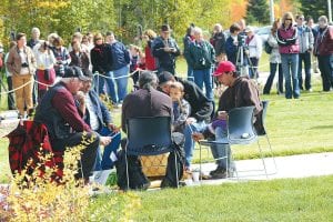 The Grand Portage Traditional Drum offered songs of celebration at the grand opening. Clockwise from left : Billy Blackwell, Wally Deschampe, Al Aubid with his son Biidaash, Patrick LeGarde and John Morrin.