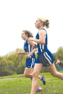 Viking cross country runners had mega-success at the Milaca MegaMeet in Hinckley on Saturday, September 25. In addition, two young racers Pete Summers and Matea Acero led their middle school teams. Left: Ninth grader Audrey Summers and senior Anna Schield ran together in the middle of the field for part of the race. Above Left: Pete Summers led the seventh grade boys, finishing with his best time of the season—13:15 in the 2-mile race. Above right: Seventh grader Matea Acero continued her winning streak, placing 15th in the 111-girl field with a time of 14:18 for the 2-mile race.