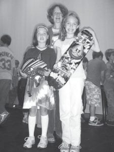 Two lucky kids who logged the healthy activities they participated in over the summer won a drawing for a skateboard and a bike, both with helmets. Sawtooth Elementary teacher K.B. O’Neill has been sponsoring a summertime Healthy Habits program for about 10 years. K.B’s sister, Great Gifts owner Nancy Cihlar, provides smaller prizes for all the participants. (L-R) Hazel Kemp (bicycle winner), Nancy Cihlar, and Linnea Gesch (skateboard winner).