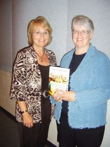 Holding the book Sparks: How Parents Can Help Ignite the Hidden Strengths of Teens are Nancy Tellett-Royce and Marilyn Peplau, of the Search Institute, who presented a workshop for ISD166 staff on September 1, 2010.