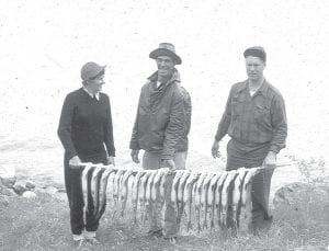 Richard Fink of Hungry Jack Lake and LaCrosse, WI shares this photo of fishing guide/resort owner Dave Clark, flanked by Helen and Ed Thien in May 1951. They obviously had a great day of fishing. The photo is from the collection of James Russell Fink, MD.