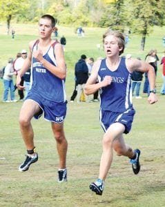 Viking cross country runners had some very good individual performances at the Hibbing Invitational on Thursday, October 7. Left: Ben Seaton (right, at Swain Meet) had a good race in the middle of the large pack of A and AA runners at the Hibbing Invite. Above left: Darren Waha fought his way through the field finishing in 20:29. Above right: Kara Ramey finished fifth in 20:41 in the JV girls’ race at Hibbing.