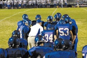 Assistant coach Mike Boomer gathers his defense around him and tries to work out a strategy to stop the East Central Eagles. Despite the score the Vikings did a good job on defense and made the Eagles work hard for every yard they picked up.