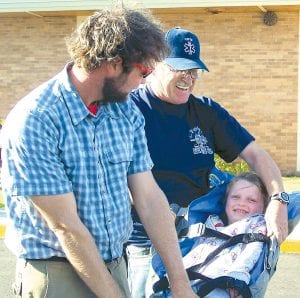 Above: Firefighters and Rescue Squad members visited the Birch Grove Community School. Mark Hutchins and Lester Smith demonstrated a “rescue” of Katie Peck.