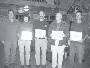 The Gunflint Trail Volunteer Fire Department gathered at Hungry Jack Lodge for its annual meeting. Gunflint Fire Chief Mike Prom presented certificates of recognition to a number of fire department and emergency medical services members. Fire Chief Prom himself has 15 years of service. (L-R) Prom, Laura Popkes, Dave Seaton, Dave Clutter, all with 15 years; Greg Gecas, 10 years. (Not pictured – Shari Baker, 15 years).