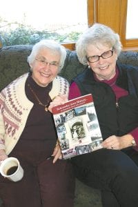 Left: Barbara Livdahl and Linda Lamb display Schroeder Area History, a book put together (with lots of help) by Livdahl. The two were at the Schroeder Area Historical Society on Oct. 16 to celebrate the second printing of this book and to listen to Laurie Hertzel. Above: Hertzel, seated, and Suzan From, contemplate a passage in Hertzel’s book News to Me. Hertzel’s book covers her 20 years at the Duluth News Tribune and features many stories she covered about the North Shore. Hertzel is currently the book editor of the Minneapolis Star Tribune. This is her second book and she is contemplating writing a third book, but hasn’t decided on a topic yet.