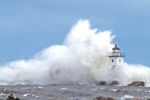 The gales of November came early, hitting the North Shore on October 27 with fierce winds and powerful waves. The Grand Marais lighthouse withstood the storm, but several boats were tossed on shore and trees were downed throughout the county. Read more about the storm on page A3.