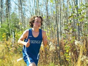 Above: Joey Chmelik gives a thumbs up during the last home meet at Pincushion. He finished his Proctor race in 20:28.