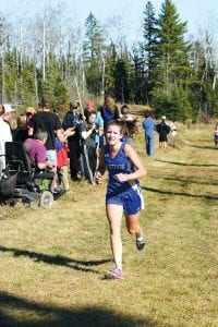 Left: In the combined varsity and JV field of 120 runners at Proctor, Freshman Audrey Summers had her strongest race of the year, finishing as the 24th JV runner in 18:56.